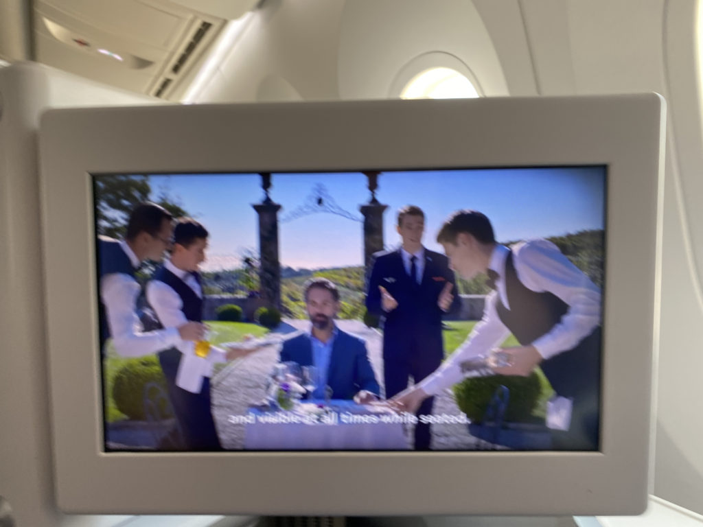 a screen with a picture of a group of men