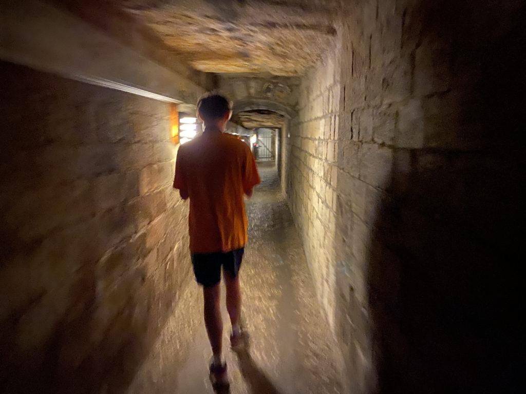 a man walking in a tunnel