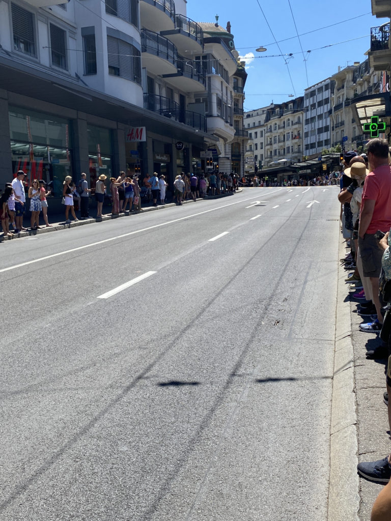 a group of people standing on a street