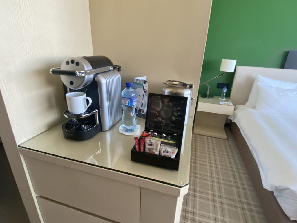a coffee machine and a container on a table
