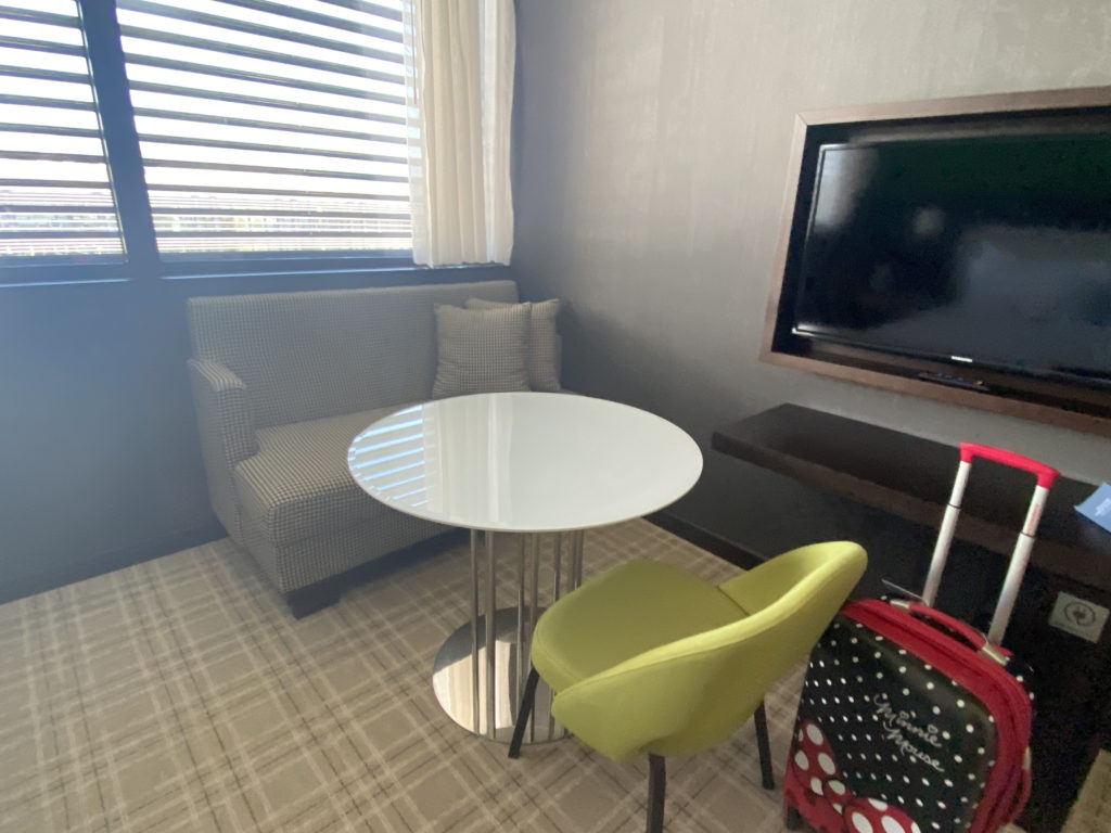 a room with a table and a tv