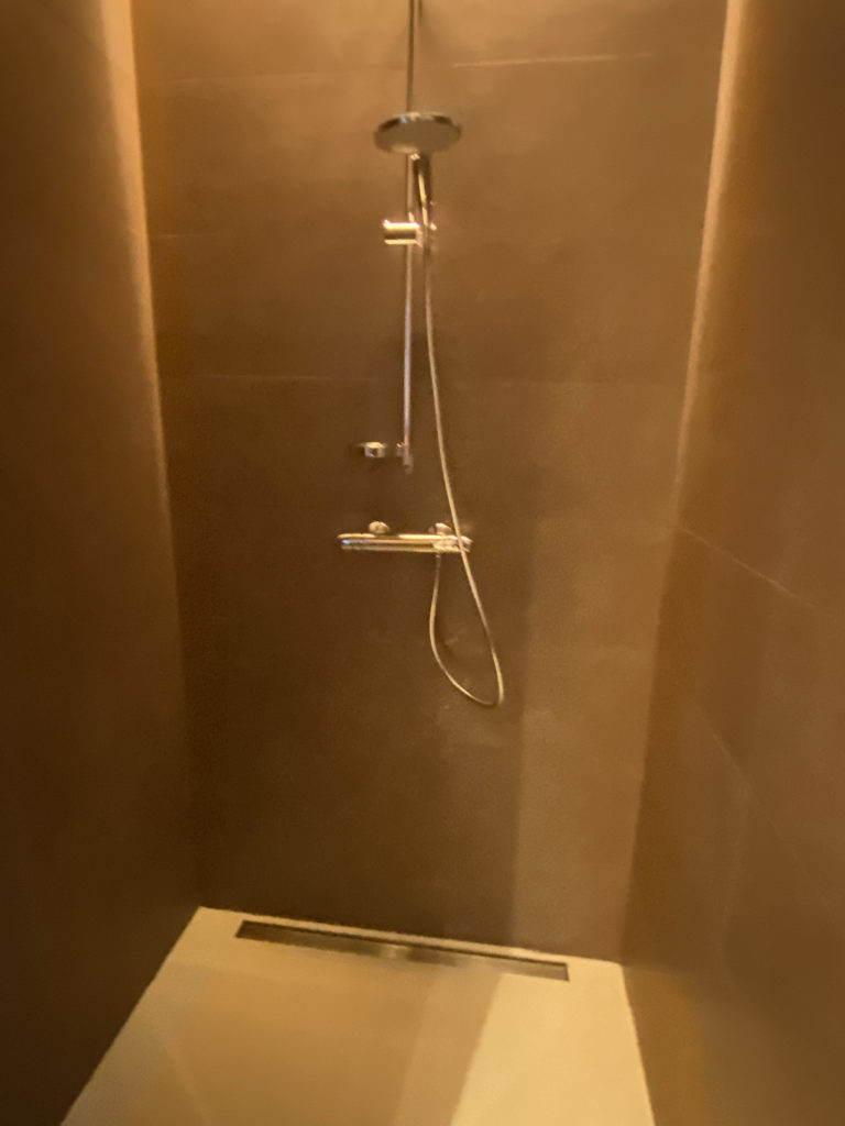 a shower head in a bathroom