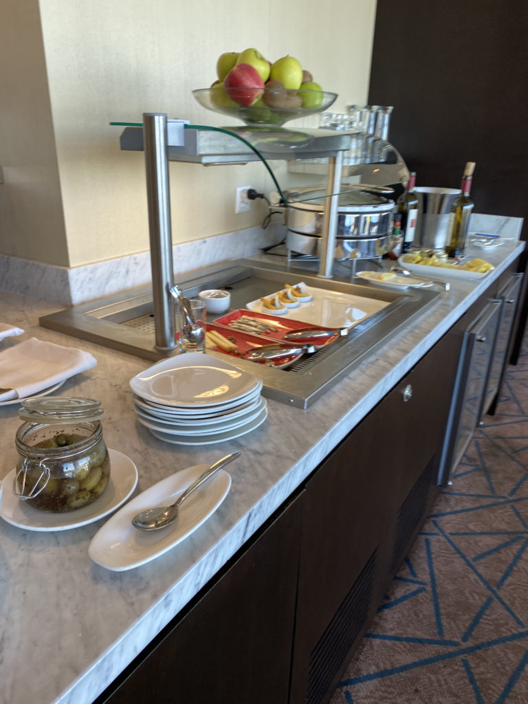 a buffet table with plates and food on it