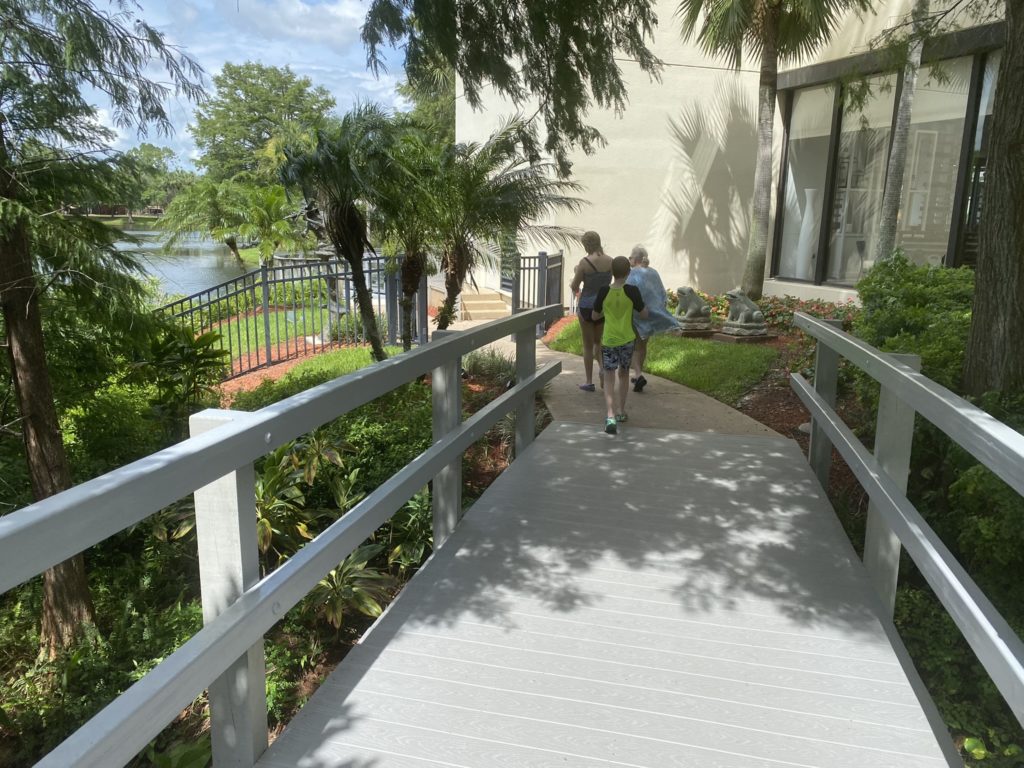 a group of people walking down a walkway