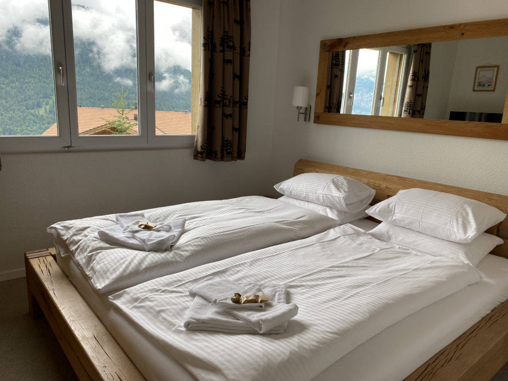 two beds with towels on each side