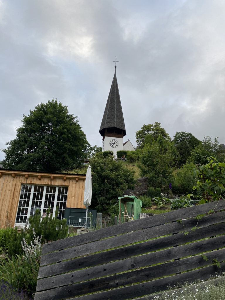 a clock tower on a hill