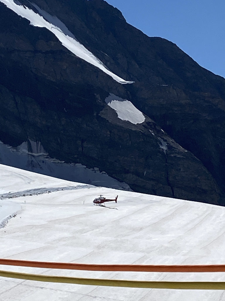 a helicopter on a snowy mountain