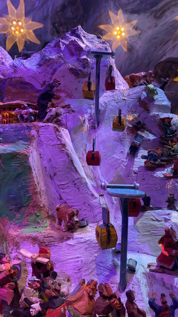 a display of a mountain with colorful objects