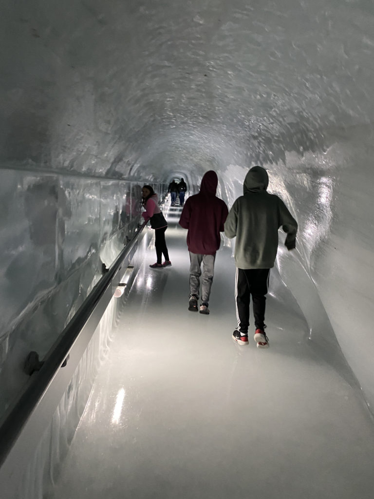 people walking in a tunnel