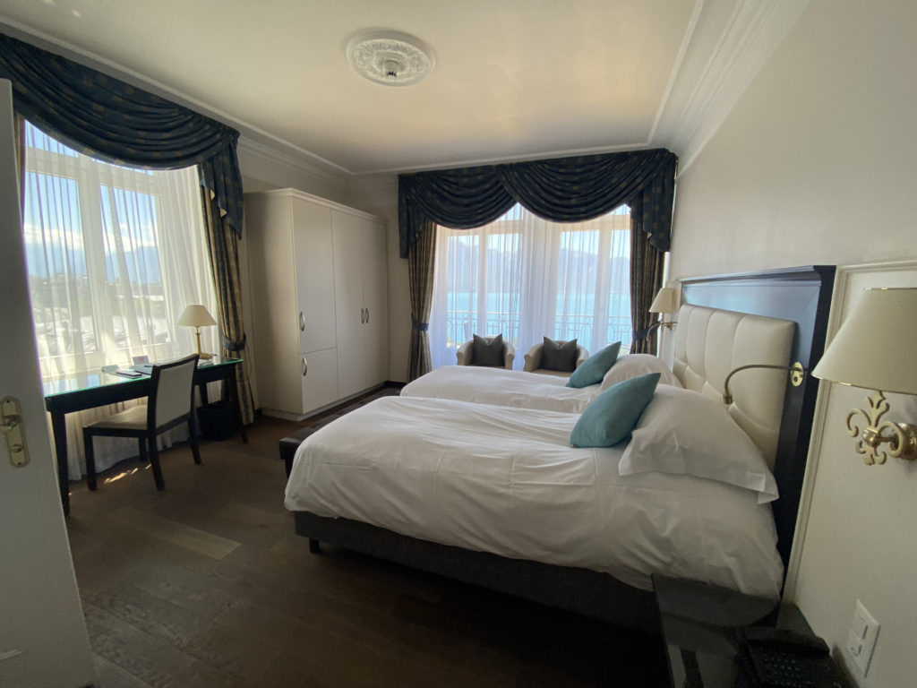 a bedroom with a bed and a desk