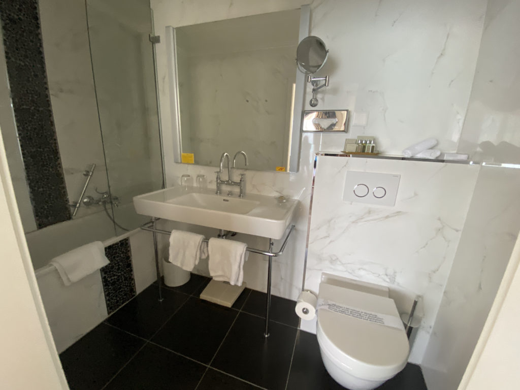 a bathroom with a sink and shower