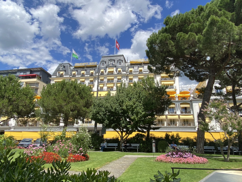 a building with trees and flowers