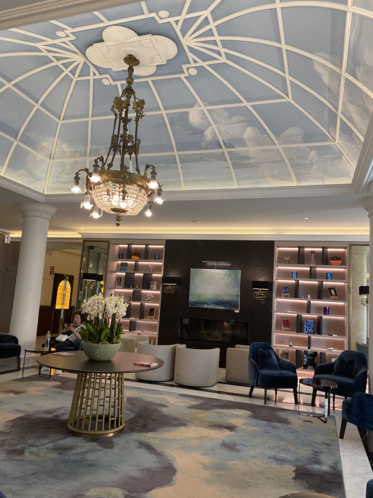 a room with a ceiling and a chandelier
