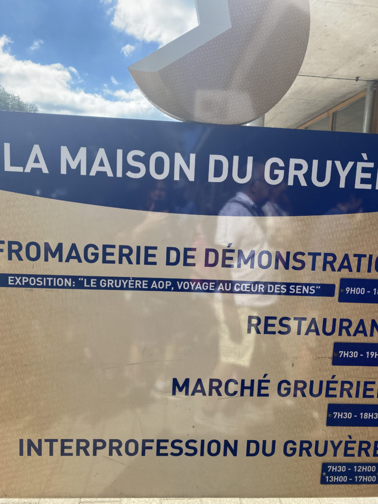 a sign with blue text and white text