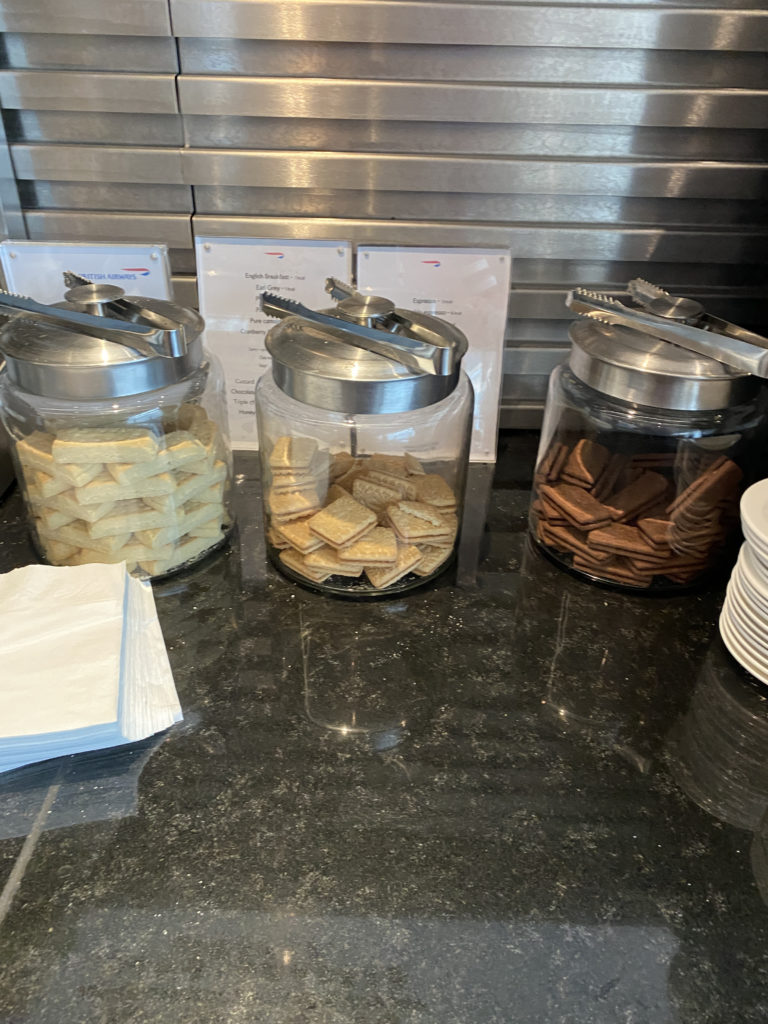 a group of glass jars with food in them