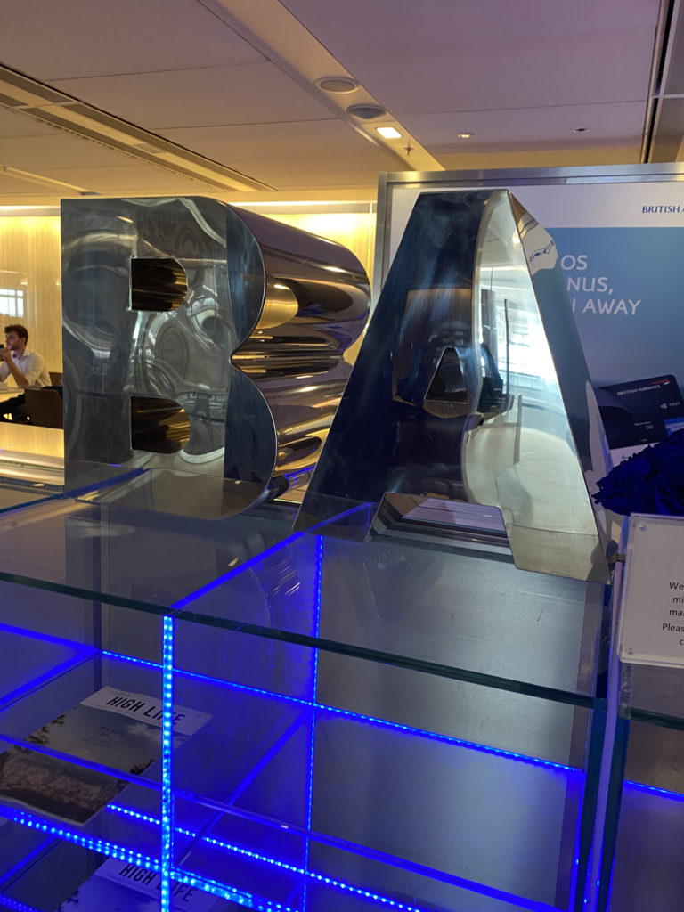 a large metal letters on a glass display
