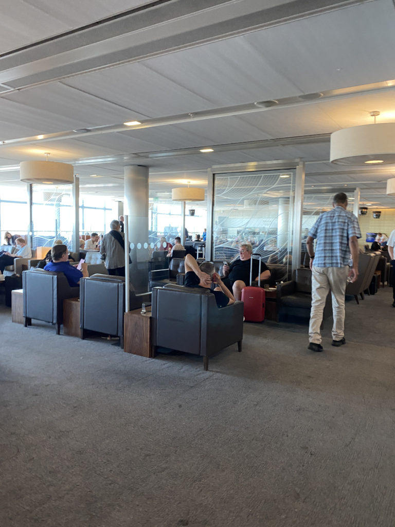 a group of people sitting in a lounge area