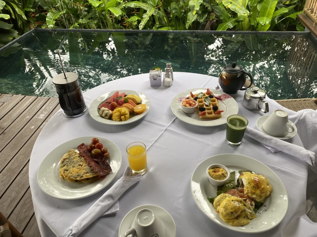 a table with plates of food and drinks on it