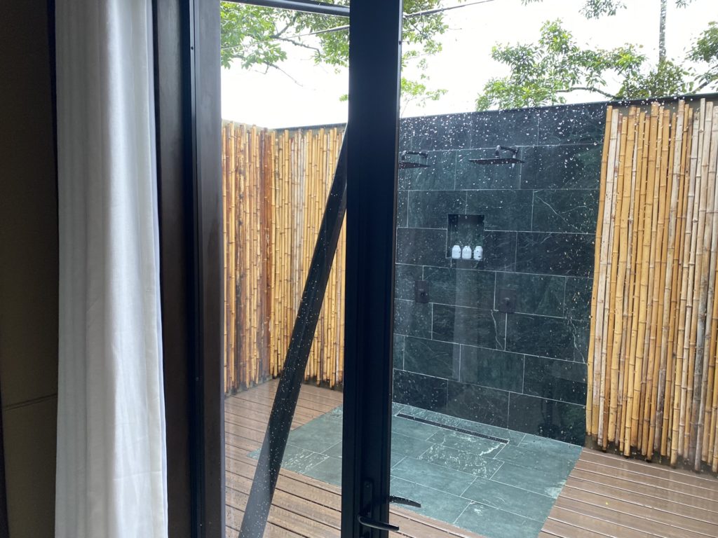 a shower outside of a room