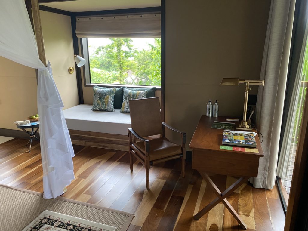 a room with a window and a chair