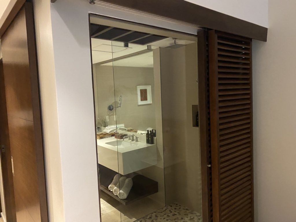 a sliding glass door with a mirror