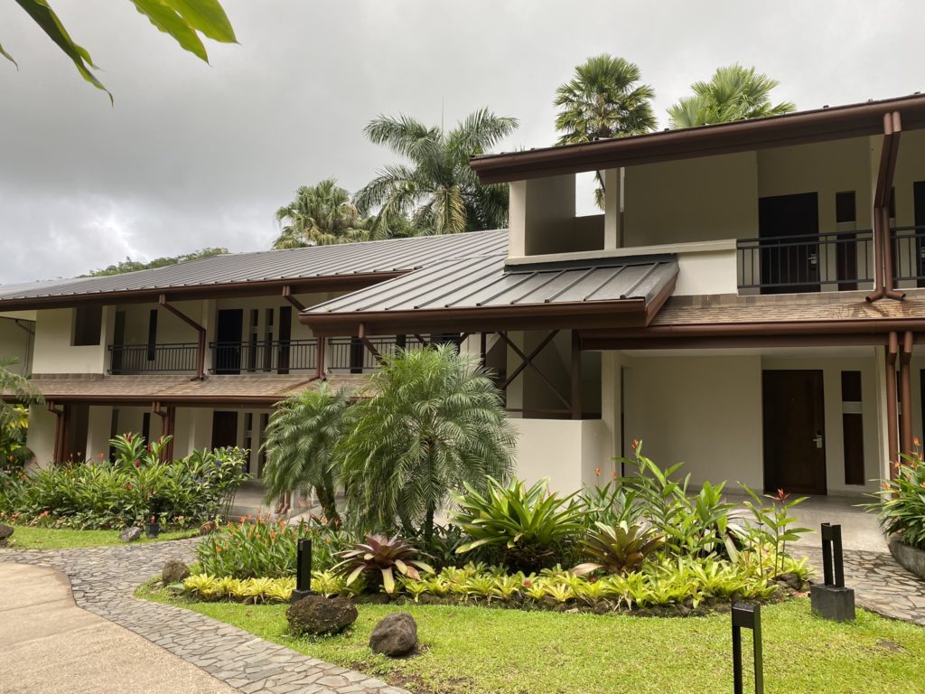 a building with trees and plants