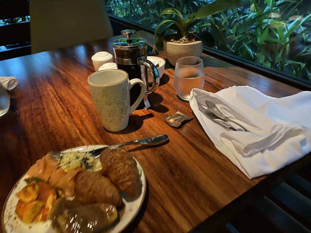 a plate of food and coffee on a table