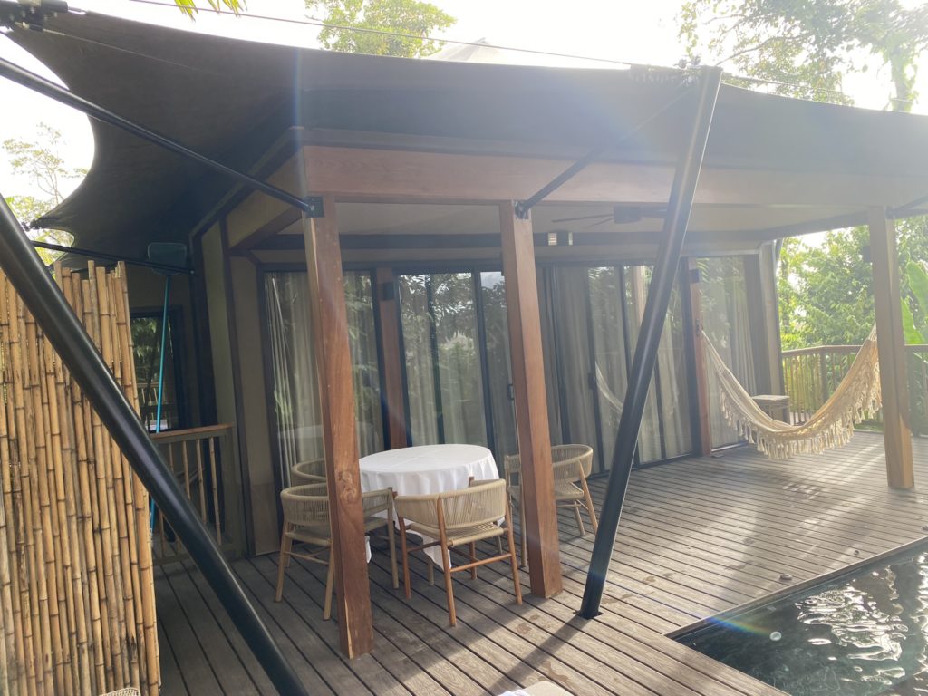 a patio with a table and chairs