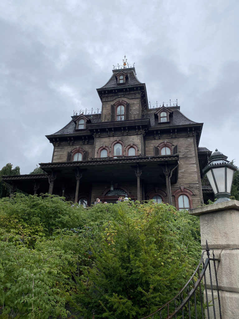 a house with a large roof and a tall tower