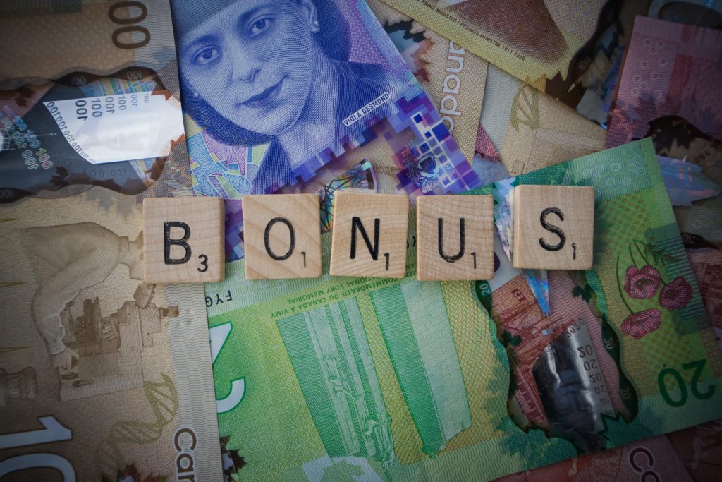 a pile of money with letters on them