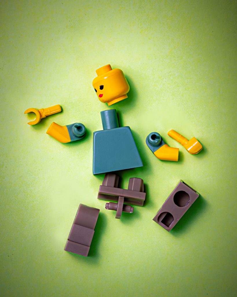 a lego figure on a green background