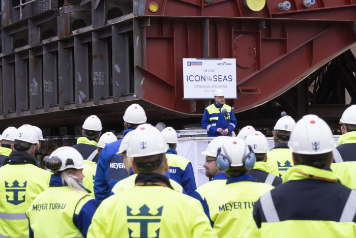 a group of people wearing hard hats and jackets