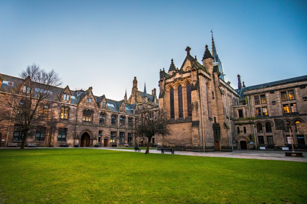 a large building with a lawn in front of it