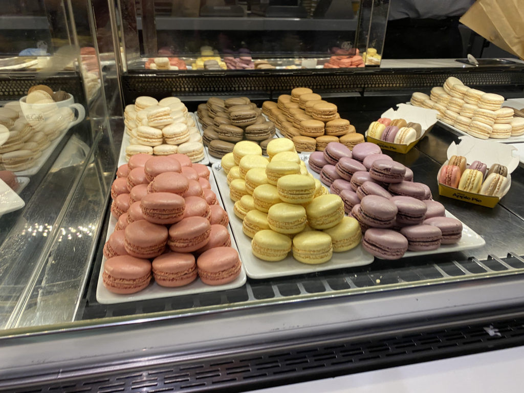 a display case of different colored macaroons