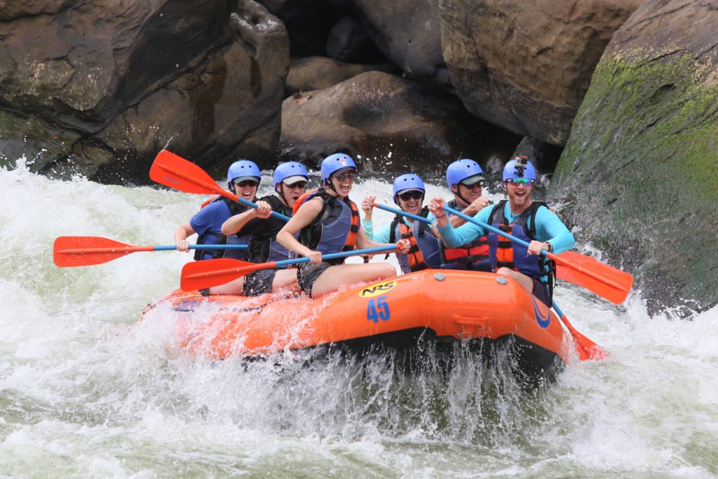 a group of people in a raft