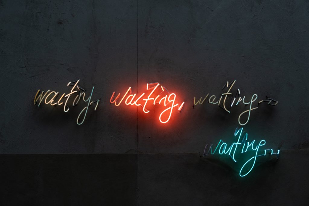 a group of neon signs