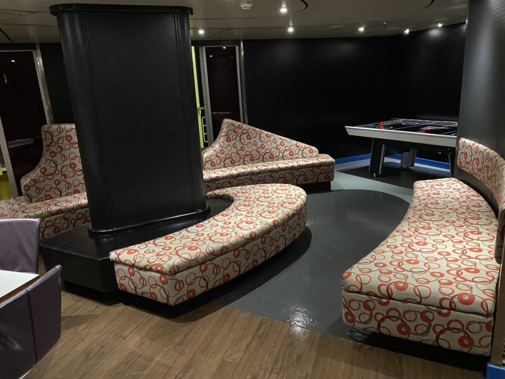 a room with a table and couches