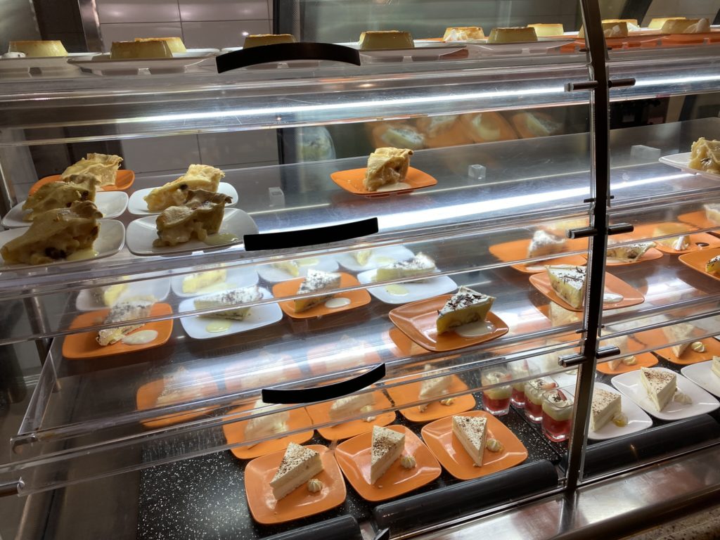 a display case with food on plates
