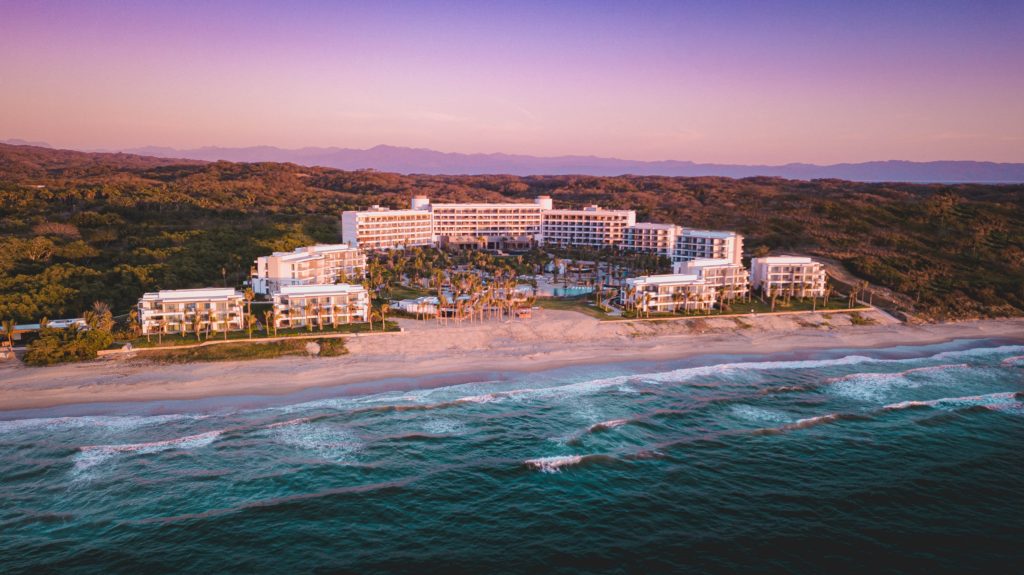 a large hotel on a beach