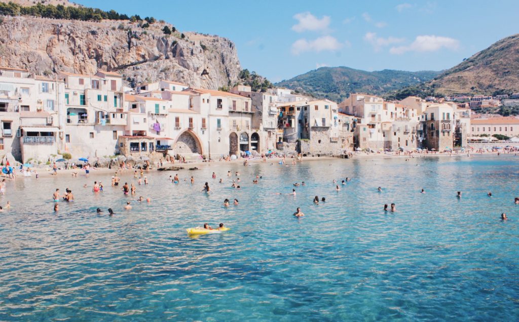 a group of people swimming in a body of water