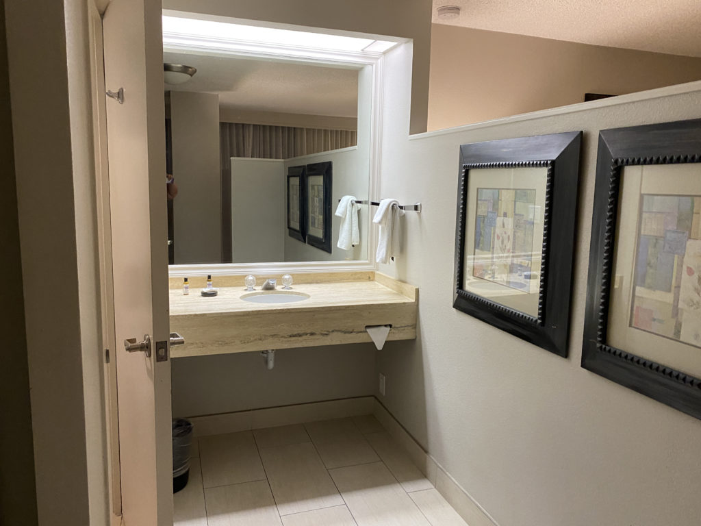 a bathroom with a mirror and sink