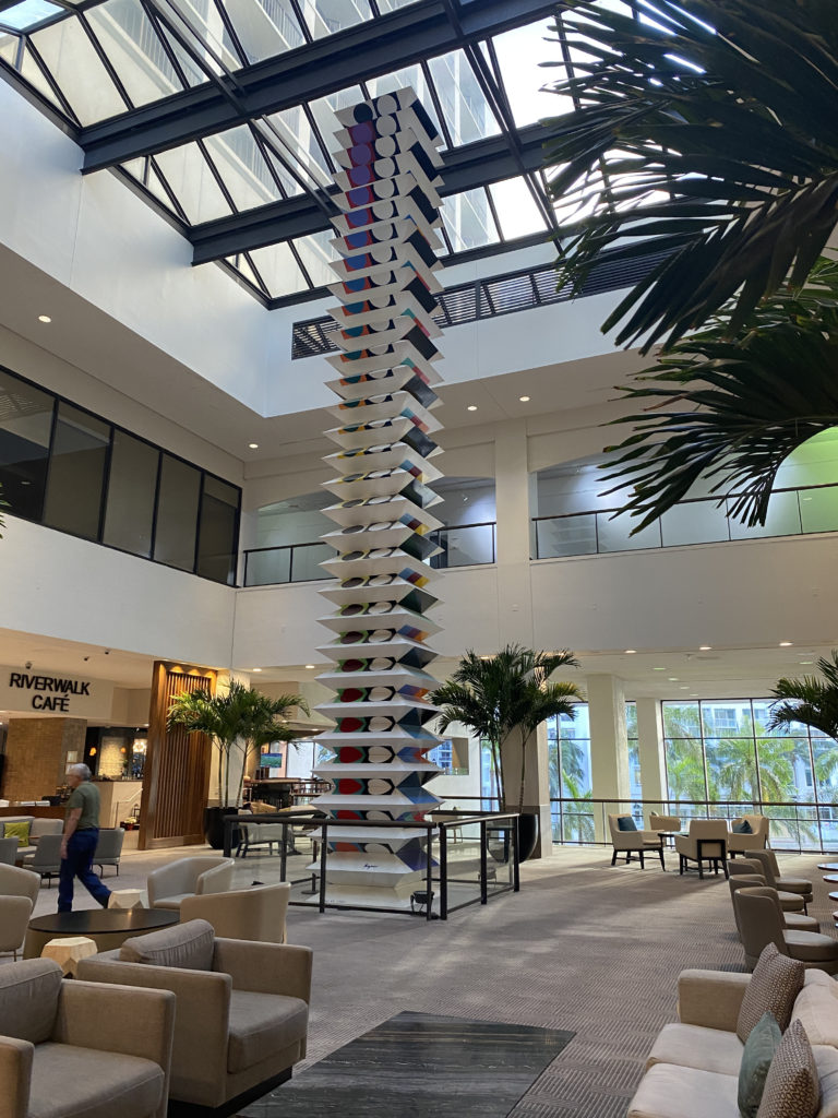 a tall sculpture in a building