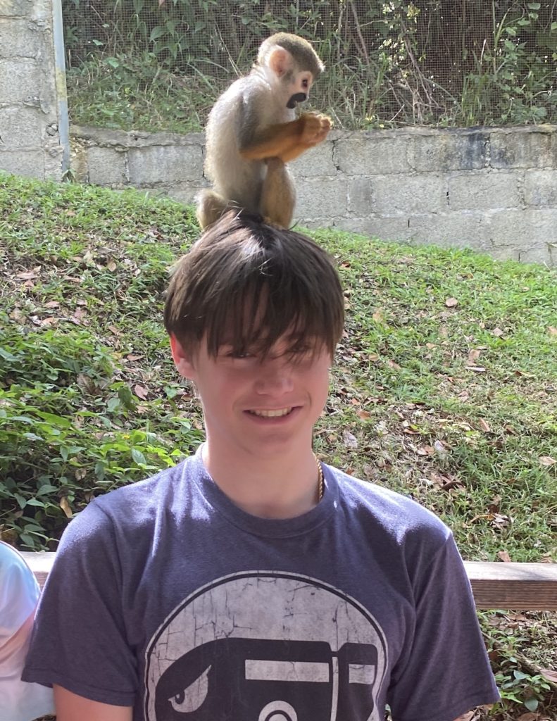 a man with a monkey on his head