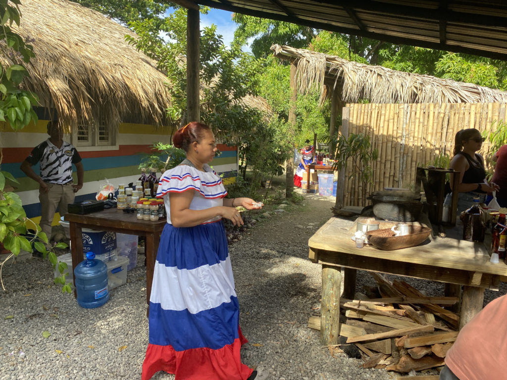 a woman in a dress standing outside