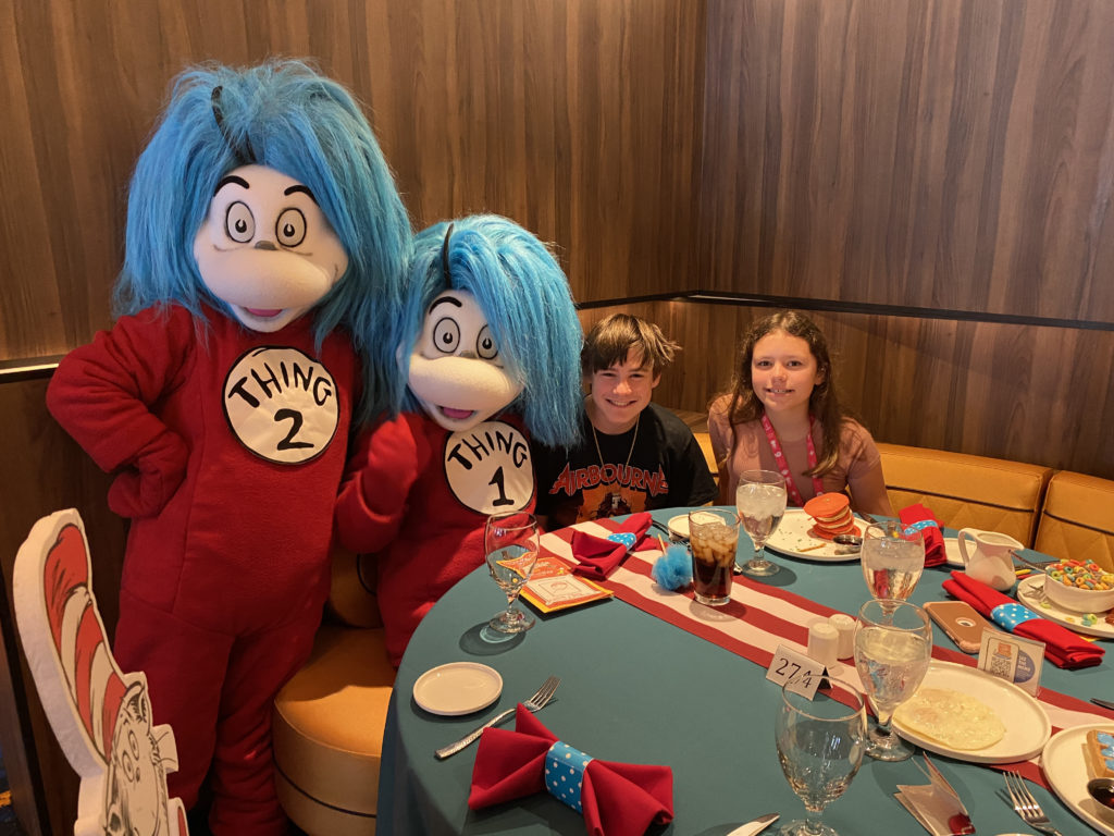 a group of people in garment at a table