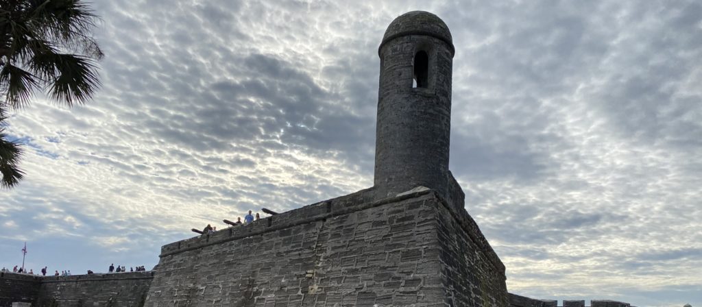 a stone tower with a round tower