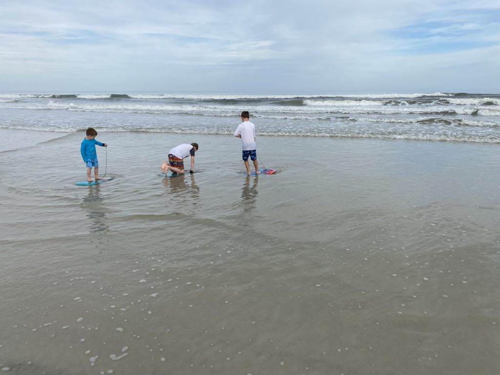 a group of kids playing in the water