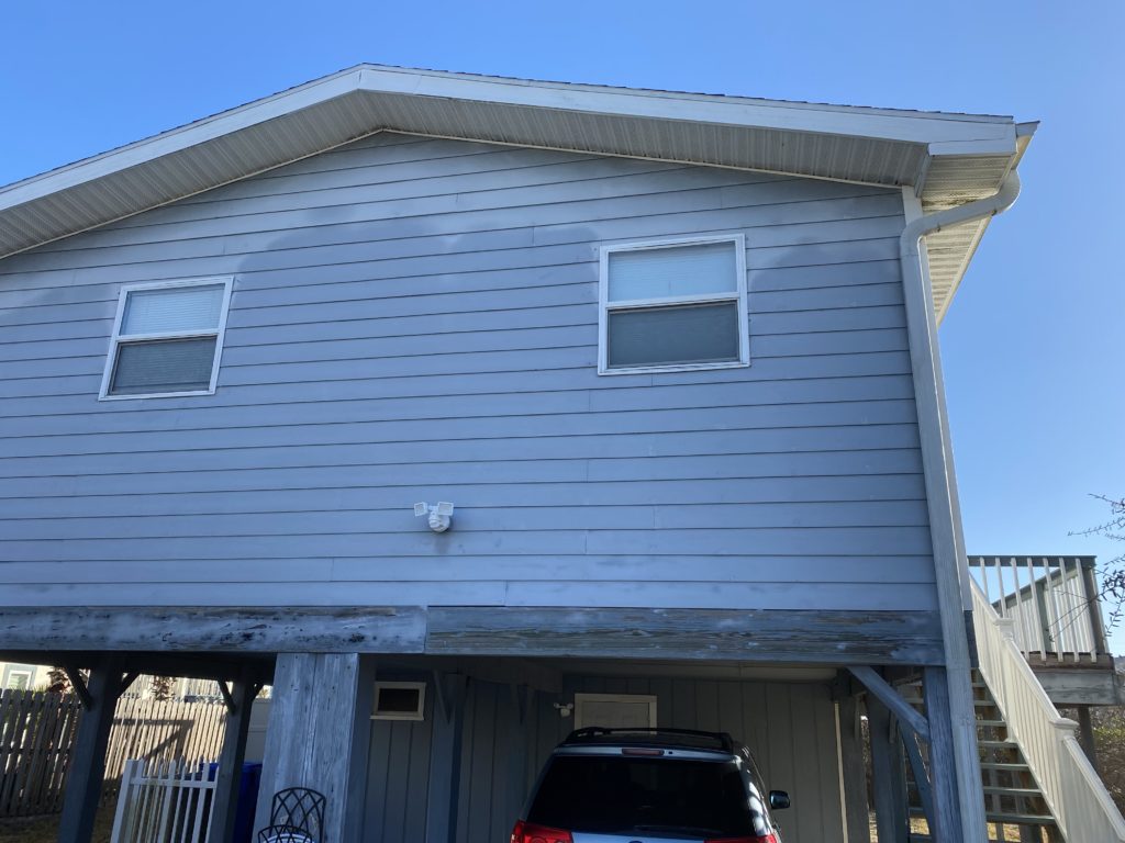 a house with a car parked in front of it