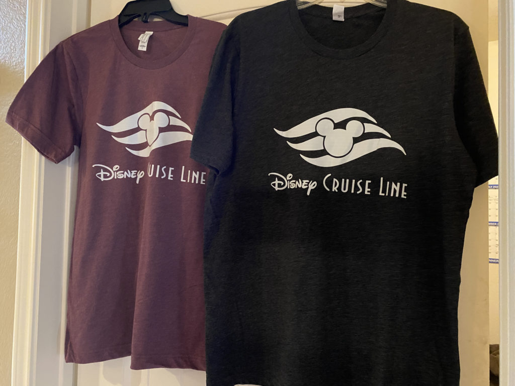 a couple of t-shirts on a door