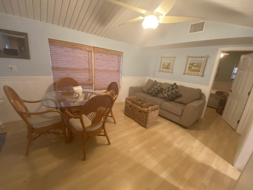 a living room with a table and couch
